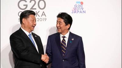 In 2019, China's President Xi Jinping is greeted by Japan's Prime Minister Shinzo Abe at the G20 leaders summit in Osaka, Japan. (REUTERS) In 2019, China's President Xi Jinping is greeted by Japan's Prime Minister Shinzo Abe at the G20 leaders summit in Osaka, Japan. (REUTERS)