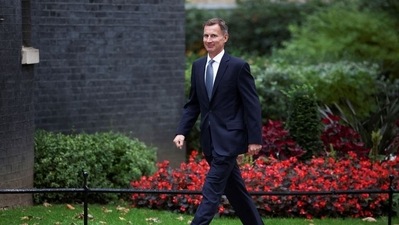 MP Jeremy Hunt walks outside Downing Street in London, Britain. (REUTERS)