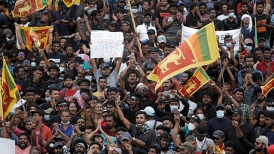 Demonstrators celebrate after entering into the Presidential secretariat, after President Gotabaya Rajapaksa fled, amid the country's economic crisis, in Colombo, Sri Lanka. (REUTERS)
