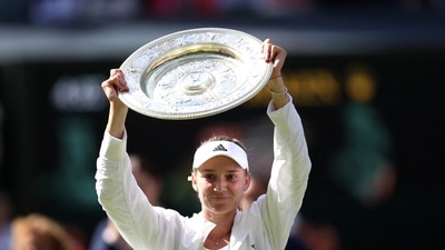Kazakhstan's Elena Rybakina celebrates with the trophy after winning the women's singles final against Tunisia's Ons Jabeur&nbsp; (REUTERS)