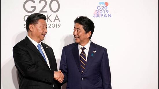In 2019, China's President Xi Jinping is greeted by Japan's Prime Minister Shinzo Abe at the G20 leaders summit in Osaka, Japan. (REUTERS) In 2019, China's President Xi Jinping is greeted by Japan's Prime Minister Shinzo Abe at the G20 leaders summit in Osaka, Japan. (REUTERS)