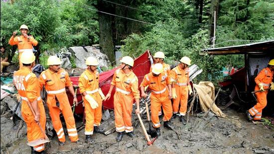 National Disaster Response Force personnel engaged in rescue work after a cloudburst at Manikaran in Kullu district of Himachal Pradesh on July 6. (HT file photo)