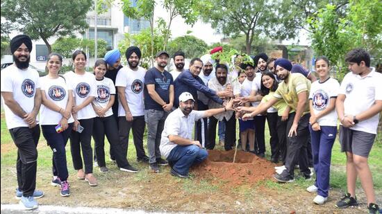 MLA (Ludhiana West) Gurpreet Gogi, deputy commissioner Surabhi Malik and MC Commissioner Shena Aggarwal and other officials of the civic body participated in the plantation drive on Saturday. (Harvinder Singh/HT)