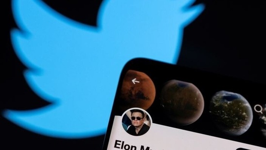 Elon Musk's twitter account is seen on a smartphone in front of the Twitter logo in this photo illustration taken, April 15, 2022. REUTERS/Dado Ruvic/Illustration(REUTERS)