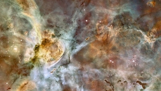 Carina Nebula is famous for its towering pillars that include "Mystic Mountain," a three-light-year-tall cosmic pinnacle captured in an iconic image by Hubble.