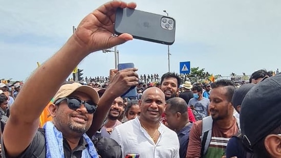 Former Sri Lanka cricket captain Sanath Jayasuriya with protesters in Colombo.(Sanath Jayasuriya/@Sanath07)