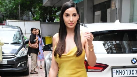 Nora Fatehi in yellow thigh-slit slip dress will steal away all your monsoon fashion blues, we love it(HT Photo/Varinder Chawla)