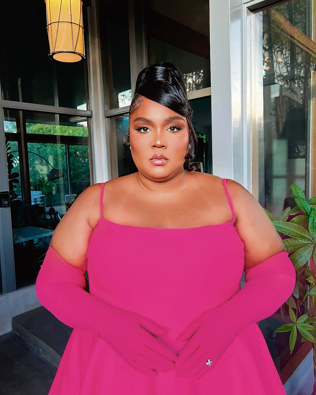 American singer Lizzo had her Barbiecore moment as she posed for a snap in a gorgeous hot pink Valentino ensemble. She donned a strappy minidress with pink gloves, pink heels and a pair of pink tights underneath. (Instagram)