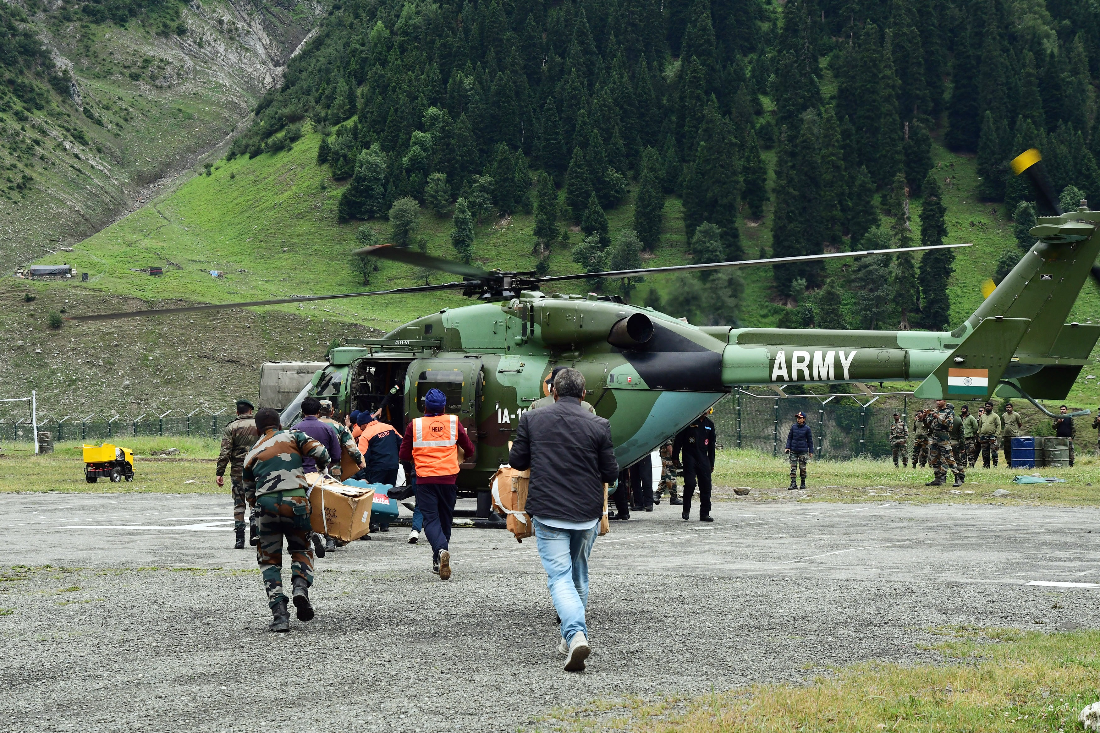 Army personnel carries medicine and other items for victims injured during the cloudburst in the Amarnath Cave site, in Baltal. (ANI Photo) Army personnel carries medicine and other items for victims injured during the cloudburst in the Amarnath Cave site, in Baltal. (ANI Photo)