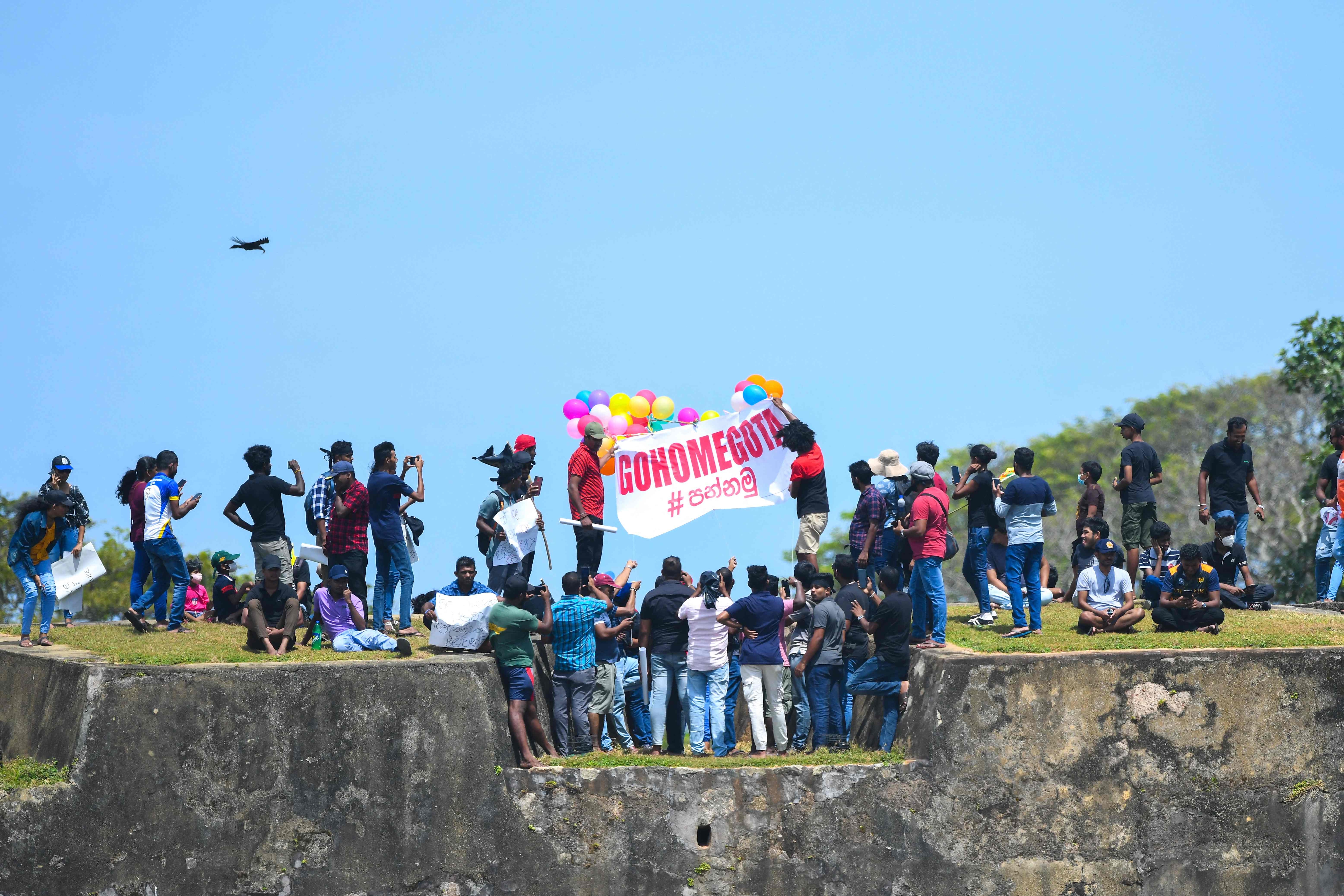 Protestors participate in an anti-government demonstration outside the Galle International Cricket Stadium during the second day play of the second cricket Test match between Sri Lanka and Australia. (AFP)