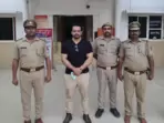 Gaurav Taneja with Noida Police personnel following his arrest. Gaurav Taneja with Noida Police personnel following his arrest.