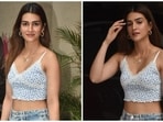 Staying trendy and fashionable during monsoons is a task. The trick is to mix your comfort and chic glamour to get a head-turning look. And it seems Kriti Sanon has cracked this sartorial hack. The paparazzi clicked the star in Mumbai, dressed in a girl-next-door attire perfect for running errands and looking stylish all at once. Scroll ahead to check out her pictures.(HT Photo/Varinder Chawla)