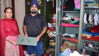 Complainant Kanwalpreet Singh and his wife showing the broken door of the locker where they had kept the jewellery. They are residents of Ranjit Singh Nagar in Ludhiana. (Harvinder Singh/HT) Complainant Kanwalpreet Singh and his wife showing the broken door of the locker where they had kept the jewellery. They are residents of Ranjit Singh Nagar in Ludhiana. (Harvinder Singh/HT)