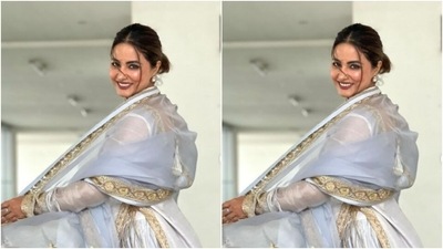 Hina decked up in a pastel grey and white salwar that came heavily embroidered in golden zari details. The salwar also featured tassel details at the knees and a plunging neckline. (Instagram/@realhinakhan)