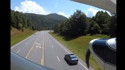 The image, taken from the Facebook video, shows the plane that a pilot landed on a highway. (Facebook/@Swain County Sheriff's Office)