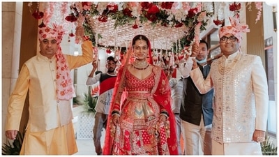 For the glam, Payal chose a simple dewy look to complement her bridal outfit. She went for a sleeked back bun, nude pink lip shade, subtle eye shadow, mascara-adorned lashes, blushed cheeks, glowing skin, and a dainty bindi. (Instagram)