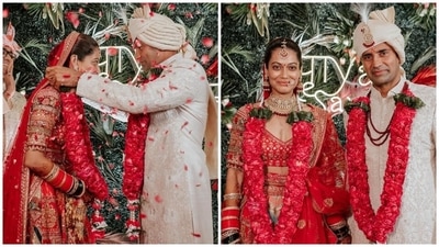 Payal's red lehenga set comes with a half-sleeve blouse featuring a deep V neckline, gold taar embroidery, heavy embellishments and patti borders. She teamed it with a matching lehenga set adorned with patchwork, embellished gota patti borders, and a side tassel-adorned waist tie. (Instagram)