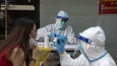 "Our city has recently continued to report more locally transmitted positive cases (of COVID-19) and the risk of the epidemic spreading through society remains very high," Zhao of the Shanghai health commission warned. (Bloomberg)