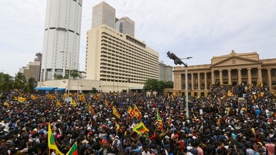 Protestors participate in an anti-government demonstration outside the President's office in Colombo on July 9, 2022. (Photo by AFP) (AFP) Protestors participate in an anti-government demonstration outside the President's office in Colombo on July 9, 2022. (Photo by AFP) (AFP)