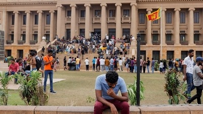 A demonstrator rests after entering the Presidential Secretariat premises, after President Gotabaya Rajapaksa fled, amid the country's economic crisis, in Colombo. (Reuters)
