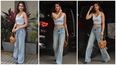Kriti accessorised the day-out look with a tan-coloured Christian Dior handbag featuring gold accents, patterned gold hoop earrings, a gold-toned ring, and two sleek chains - one carrying an initial 'K' pendant. (HT Photo/Varinder Chawla) Kriti accessorised the day-out look with a tan-coloured Christian Dior handbag featuring gold accents, patterned gold hoop earrings, a gold-toned ring, and two sleek chains - one carrying an initial 'K' pendant. (HT Photo/Varinder Chawla)