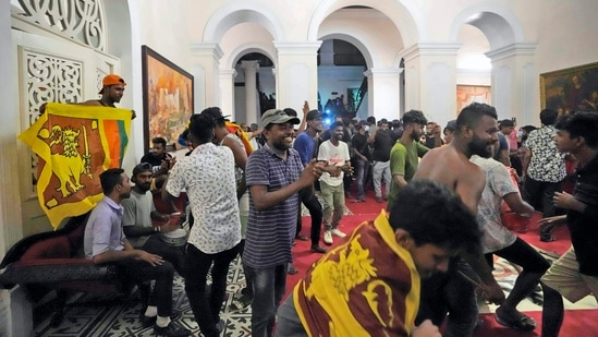 Protesters sing and dance after storming in at the Sri Lankan president official residence, in Colombo, Sri Lanka.&nbsp;(AP)