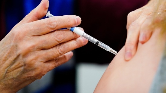 Vaccinated people can still spread Covid infection as vaccines do not necessarily prevent one from the disease. So they should continue to follow social distancing and wear mask to protect spreading the infection to the vulnerable group.(AP)