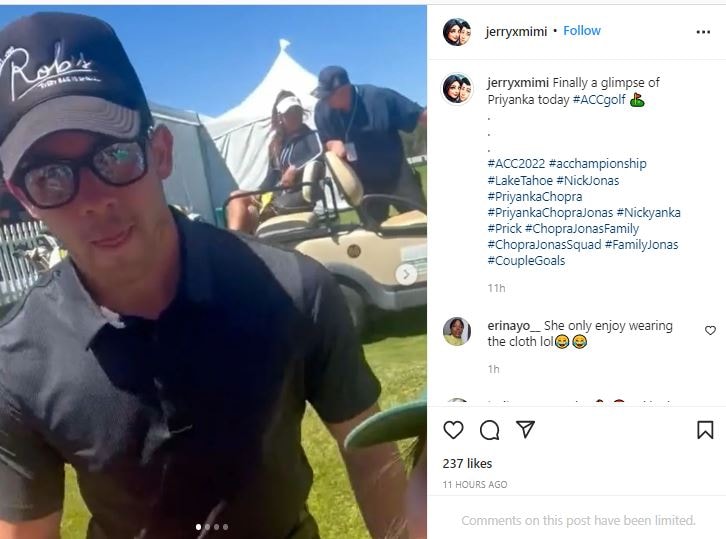 Nick Jonas posed with a fan as Priyanka sat on a golf cart behind him.