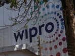 Employees enter a Wipro Ltd. office building in the Electronic City area of Bengaluru. (Bloomberg file image) Employees enter a Wipro Ltd. office building in the Electronic City area of Bengaluru. (Bloomberg file image)