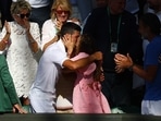 Novak Djokovic celebrates with wife Jelena Djokovic in the stands after winning the men's singles Wimbledon final.