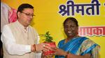 NDA’s presidential candidate Droupadi Murmu with Uttarakhand chief minister Pushkar Singh Dhami (left) in Dehradun on Monday. (HT Photo)