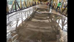 Kalyan railway station platforms and FOBs are waterlogged, claimed the commuters.  (HT PHOTO)