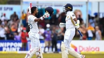 Dinesh Chandimal celebrates with teammate Kasun Rajitha after scoring 200 on Day 4 of the second Test between Sri Lanka and Australia (AFP) Dinesh Chandimal celebrates with teammate Kasun Rajitha after scoring 200 on Day 4 of the second Test between Sri Lanka and Australia (AFP)