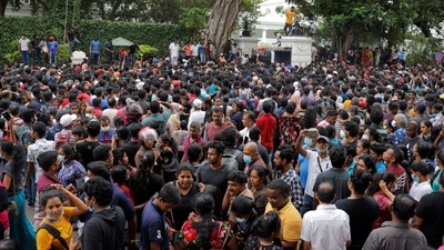 People wait to visit the President's house on the day after demonstrators entered the building, after President Gotabaya Rajapaksa fled, amid the country's economic crisis, in Colombo.&nbsp; (REUTERS)