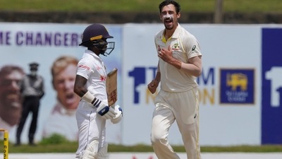 Australia's Mitchell Starc , right, celebrates taking the wicket of Sri Lanka's Pathum Nissanka (AP)