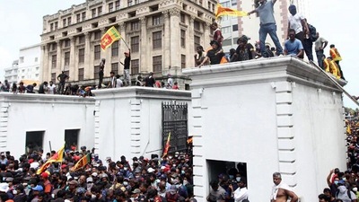 Irate public instaged by the Leftist narrative on social media stormed Sri Lankan President's official quarters, forcing the incumbent Gotabaya Rajpaksa to seek shelter at the Army Headquarters. Irate public instaged by the Leftist narrative on social media stormed Sri Lankan President's official quarters, forcing the incumbent Gotabaya Rajpaksa to seek shelter at the Army Headquarters.