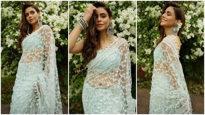 In the end, Aamna chose a centre-parted ponytail, shimmering pink eye shadow, mascara on the lashes, glossy pink lip shade, dewy base, blushed cheeks, beaming highlighter and sharp contouring for the glam picks. What do you think of her floral ruffled saree and backless blouse? (Instagram) In the end, Aamna chose a centre-parted ponytail, shimmering pink eye shadow, mascara on the lashes, glossy pink lip shade, dewy base, blushed cheeks, beaming highlighter and sharp contouring for the glam picks. What do you think of her floral ruffled saree and backless blouse? (Instagram)