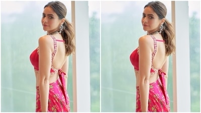 Coming to the design details, Aamna's pre-draped georgette six yards comes in a dark pink shade decorated with floral patterns in green, red, yellow and pink hues. The saree also features tiered ruffle additions on the hem and the pallu. (Instagram) Coming to the design details, Aamna's pre-draped georgette six yards comes in a dark pink shade decorated with floral patterns in green, red, yellow and pink hues. The saree also features tiered ruffle additions on the hem and the pallu. (Instagram)