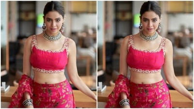 The intricate golden embroidery, a floral printed fabric tie and a backless detail enhanced the beauty of Aamna's cropped choli. She further glammed it up with oxidised silver stacked bracelets, matching heavy jhumkis and a choker necklace with stone adornments. (Instagram) The intricate golden embroidery, a floral printed fabric tie and a backless detail enhanced the beauty of Aamna's cropped choli. She further glammed it up with oxidised silver stacked bracelets, matching heavy jhumkis and a choker necklace with stone adornments. (Instagram)
