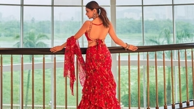 Additionally, Aamna elegantly placed the pallu of her pre-draped saree on her hand to appropriately display her pink-coloured blouse. It has a wide U neckline decked in golden taar embroidery, dainty embellishments and a midriff-revealing hem. (Instagram) Additionally, Aamna elegantly placed the pallu of her pre-draped saree on her hand to appropriately display her pink-coloured blouse. It has a wide U neckline decked in golden taar embroidery, dainty embellishments and a midriff-revealing hem. (Instagram)