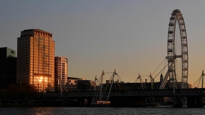 The London Eye wheel is seen at sunset, amid the outbreak of the coronavirus disease on the first day of a newly imposed lockdown, in London, Britain. (REUTERS) The London Eye wheel is seen at sunset, amid the outbreak of the coronavirus disease on the first day of a newly imposed lockdown, in London, Britain. (REUTERS)
