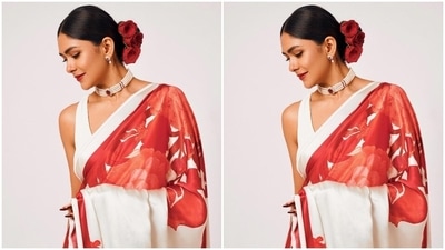 Additionally, the six yards also features a floral pattern in a red hue and a striped detail on the border. In the end, a sleeveless white blouse with a V neckline and a bodycon silhouette rounded it all off. (Instagram) Additionally, the six yards also features a floral pattern in a red hue and a striped detail on the border. In the end, a sleeveless white blouse with a V neckline and a bodycon silhouette rounded it all off. (Instagram)