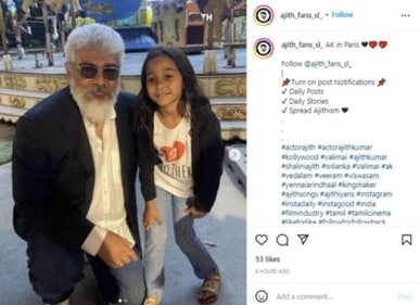 Ajith posed with a young fan.