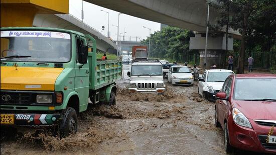 Vehicles wade through a flooded stretch of a road under the busy Hebbal flyover in Bengaluru (AFP file photo)
