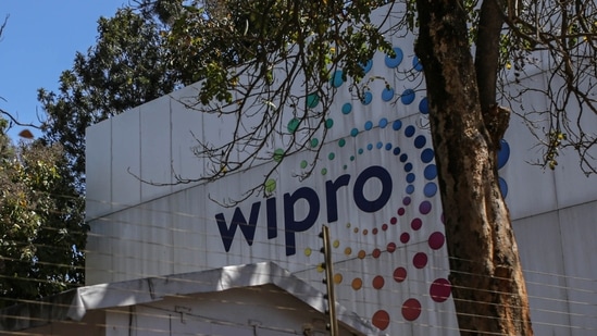 Employees enter a Wipro Ltd. office building in the Electronic City area of Bengaluru. (Bloomberg file image)