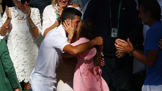 Novak Djokovic celebrates with wife Jelena Djokovic in the stands after winning the men's singles Wimbledon final.(REUTERS)