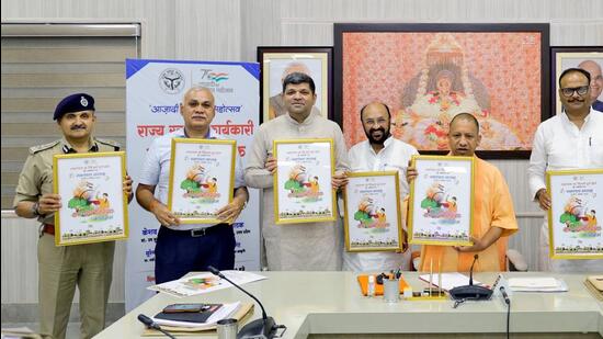 Uttar Pradesh chief minister Yogi Adityanath and others at an event associated with the upcoming Swatantrata Saptah. (SOURCED IMAGE)