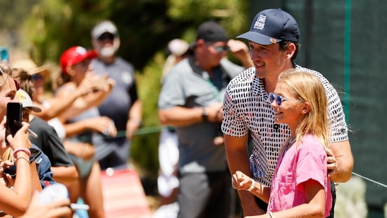 Actor Miles Teller poses for a picture with a fan near the 17th hole during the final round of the American Century Championship. (Getty Images/AFP)(AFP)