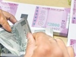 Rupee against US dollar (AFP) Rupee against US dollar (AFP)
