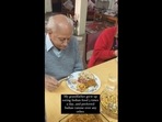 The image shows an elderly man enjoying his Mexican meal.&nbsp;